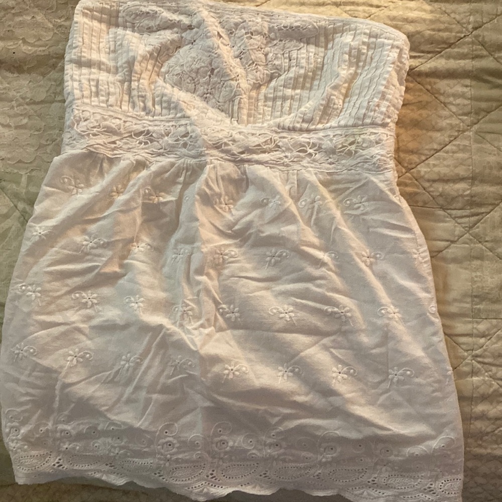 Very sweet white eyelet bustier top. Never warn (despite the wrinkles)